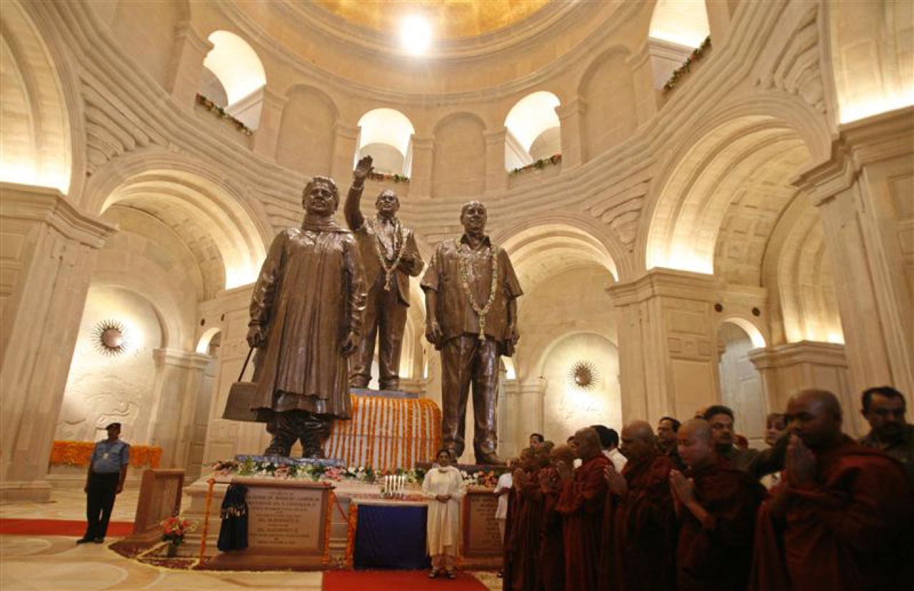Mayawati poses under the statues of Dalit icons Ambedkar, Ram and of herself after inaugurating the Rashtriya Dalit Prerna Sthal park in Noida