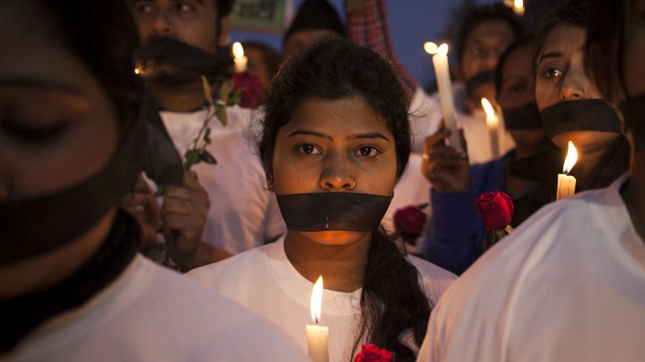 Indian women participate in a candle light vigil at a bus stop where the victim of a deadly gang rape in a moving bus had boarded the bus two years ago, in New Delhi, India, Tuesday, Dec. 16, 2014. The case sparked public outrage and helped make women’s safety a common topic of conversation in a country where rape is often viewed as a woman’s personal shame to bear. (AP Photo/Tsering Topgyal)